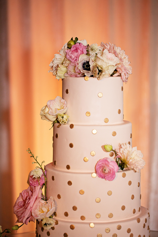 gold polka dot wedding cake with flowers