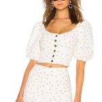 polka dot top with buttons by lpa. sold at revolve. chic summer look in white and tan.