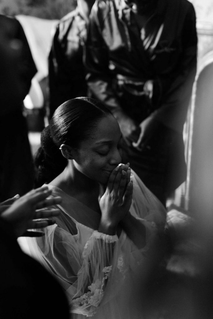 bride praying before her wedding