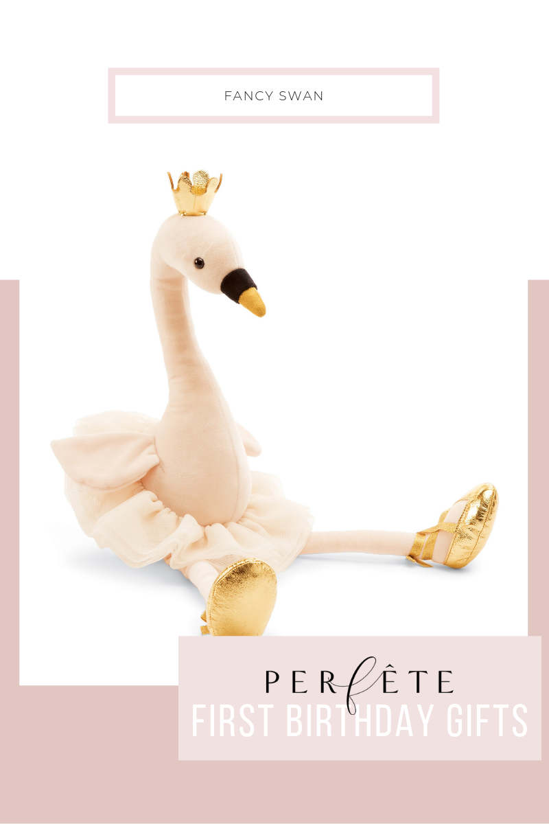 fancy swan stuffed toy in light pink with gold crown, tutu, and gold ballet flats
