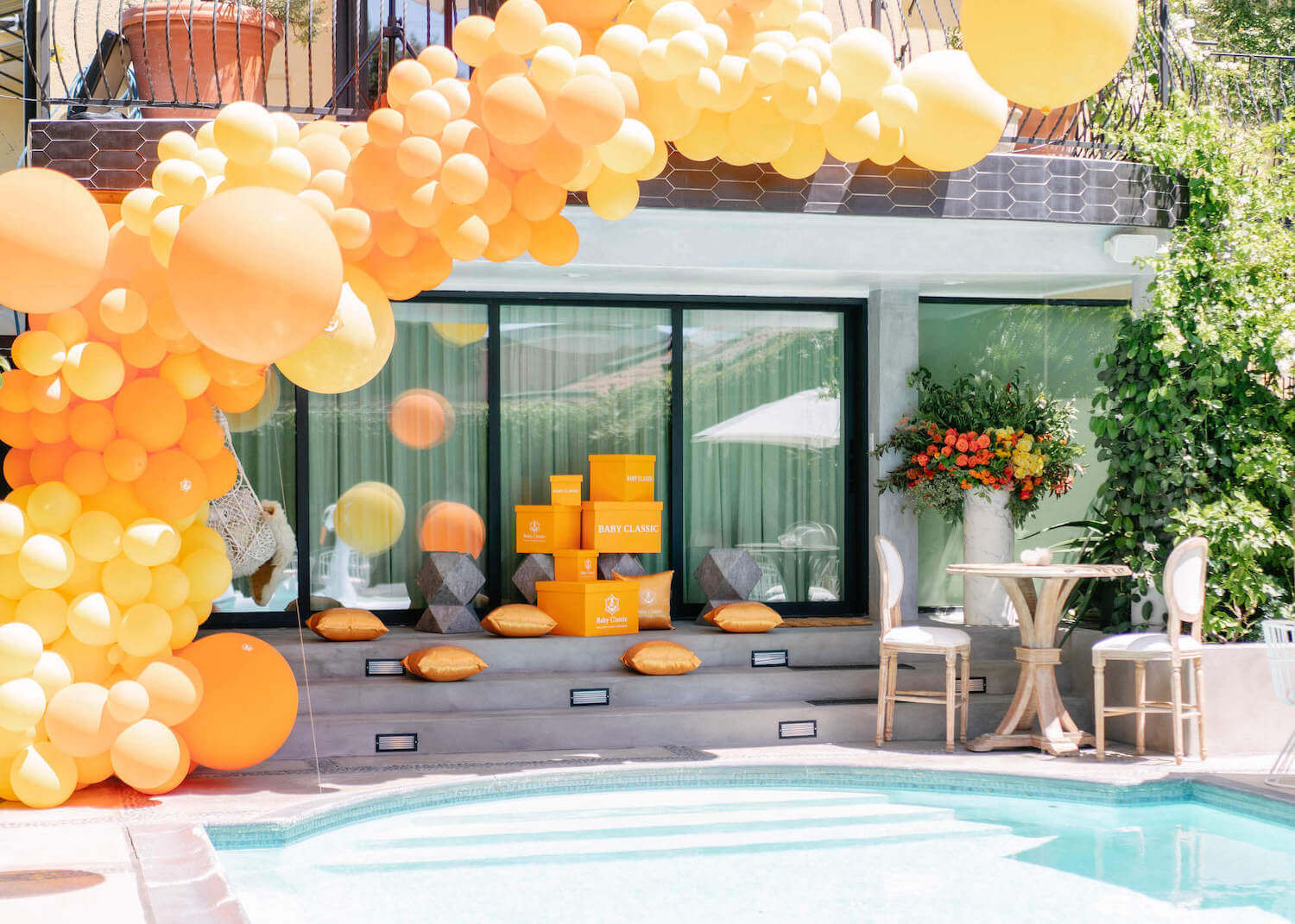 Pool baby shower with balloon garland decor 