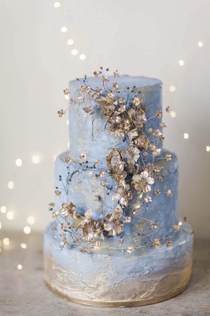 blue spring cake with gold flowers