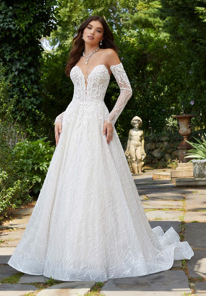 Detachable sleeves on long sleeve wedding dress with plunging neckline