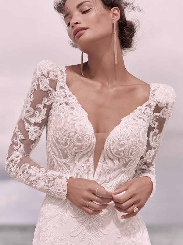 Lace long sleeve wedding dress with deep plunging neckline